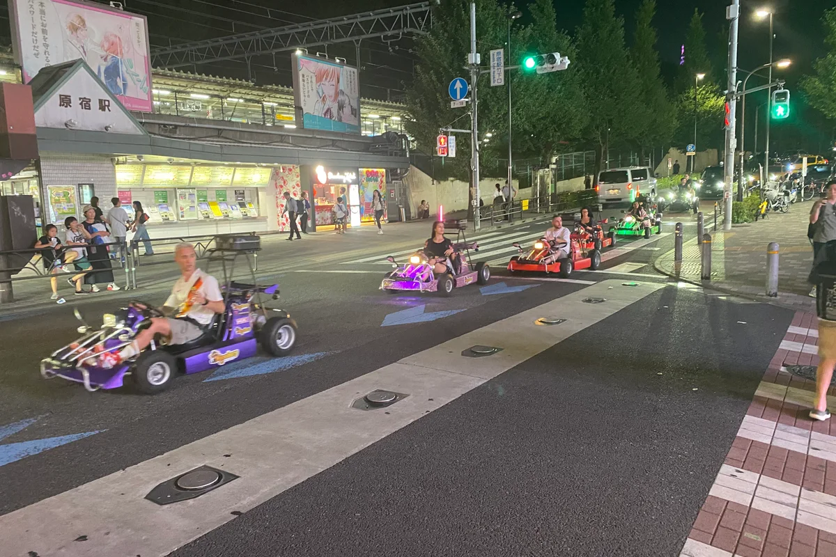 Tourists driving go-karts through Tokyo traffic